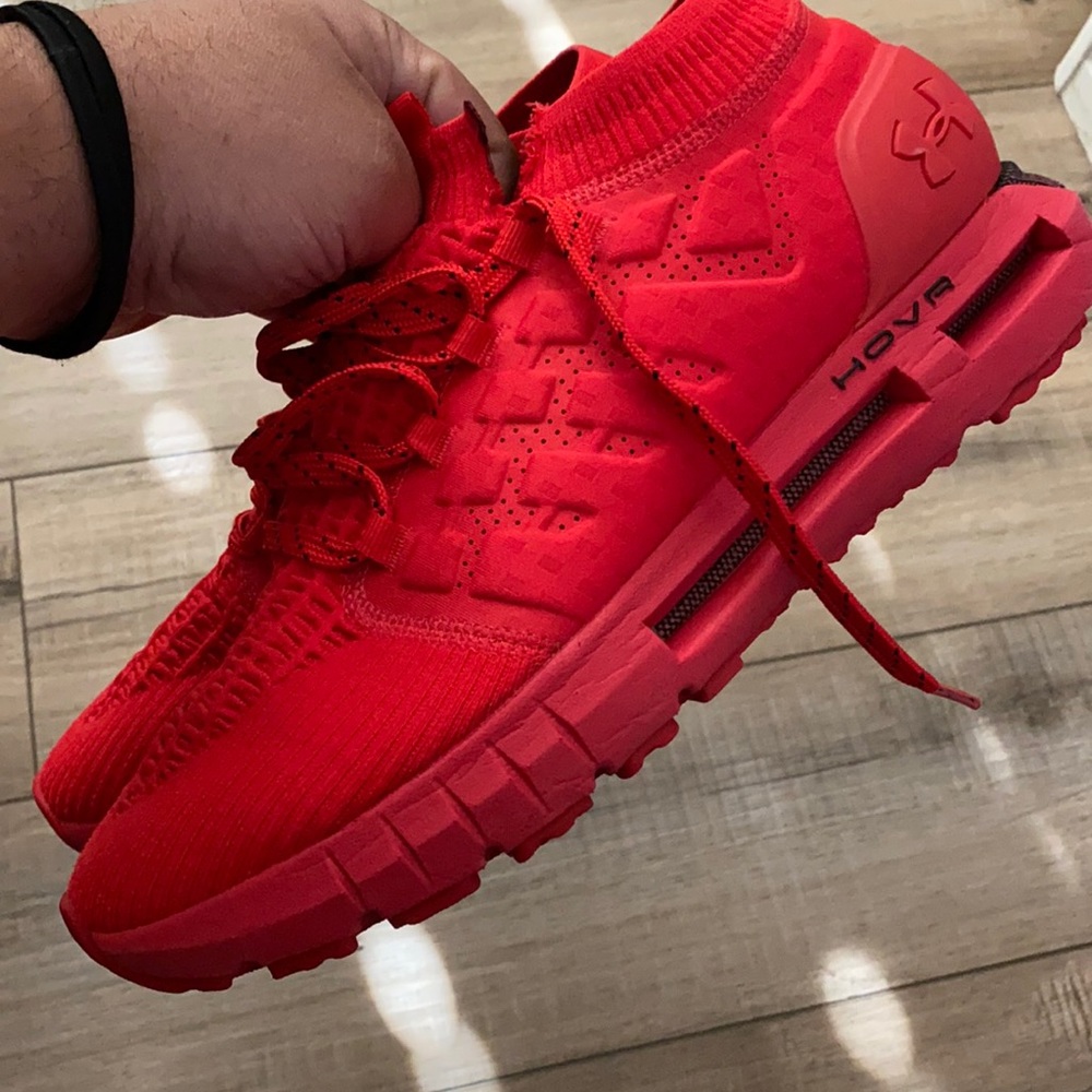 Red hovr running shoes